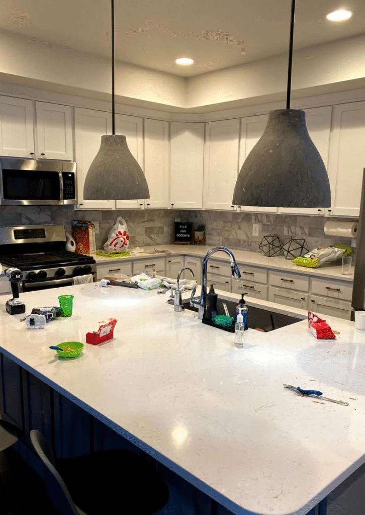 Before our kitchen update, the space was a little dark. I removed the concrete pendants and dark gray and white backsplash. 